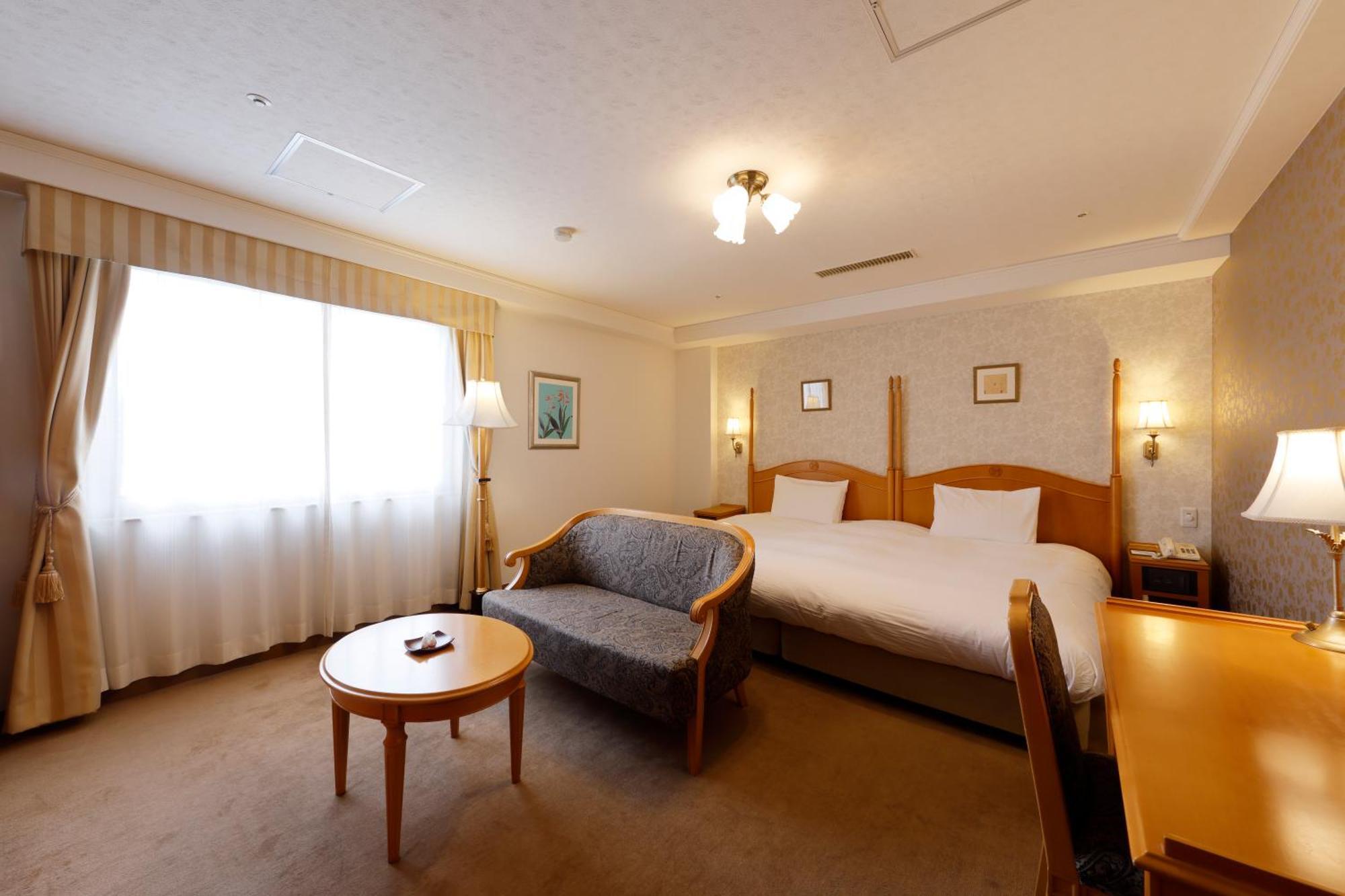 가나자와 하쿠초로 호텔 산라쿠 외부 사진 A room at the hotel